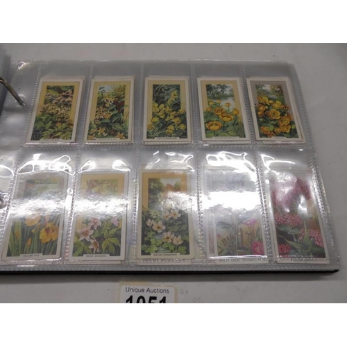 1051 - An album of cigarette cards, Liebig cards etc.,