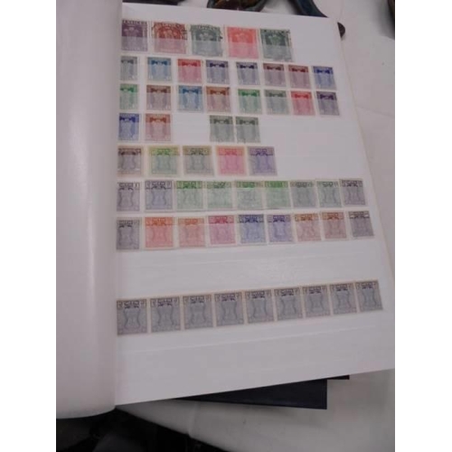 1055 - Five albums of UK and Commonwealth stamps including Victorain.