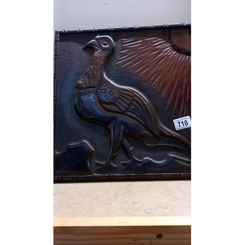 710 - A large carved mahogany plaque of a bird 35cm x 37cm