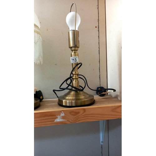 713 - A pair of antiqued brass table lamps 1 with shade