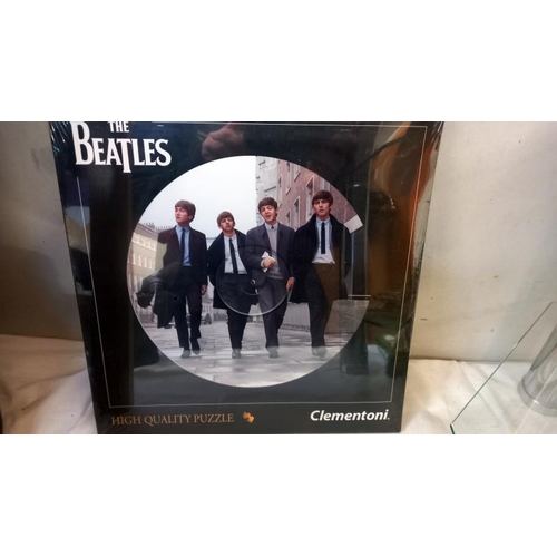 726 - 3 sealed 'The Beatles' LP sized round jigsaws