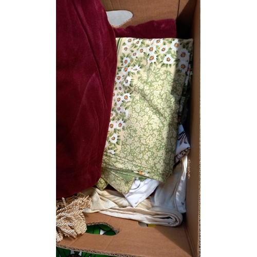 771 - A box of material, curtains and 1970's sunflower tablecloth etc