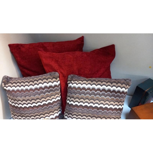 796 - 4 cushions and a bolster cushion