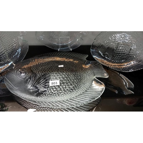 803 - A large glass fish plate and 3 small fish plates