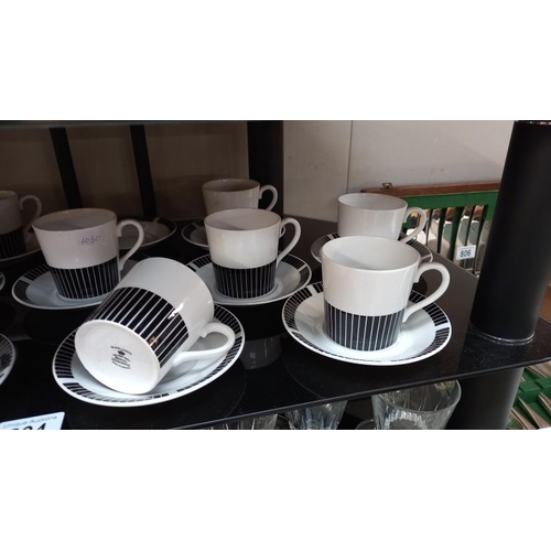 804 - A Royal Osborne black and white tea set, (11 cups, 12 saucers)