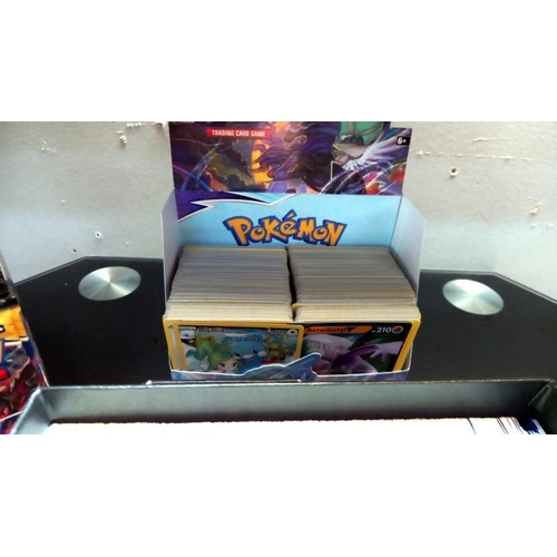 814 - A large collection of Pokemon cards, pokeball etc some cards unopened