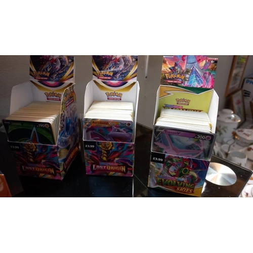 814 - A large collection of Pokemon cards, pokeball etc some cards unopened