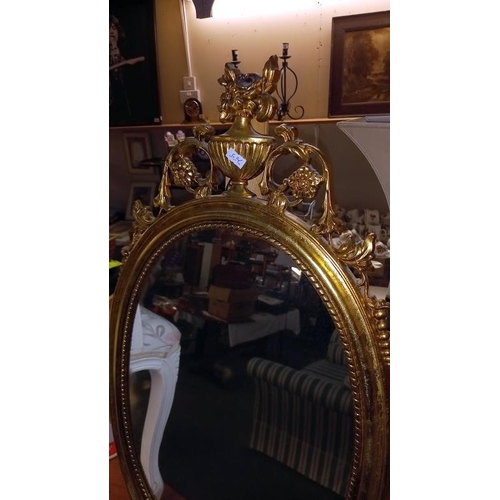 838 - A gilt ormalu framed oval mirror, 40cm x 76cm (stand not included), COLLECT ONLY