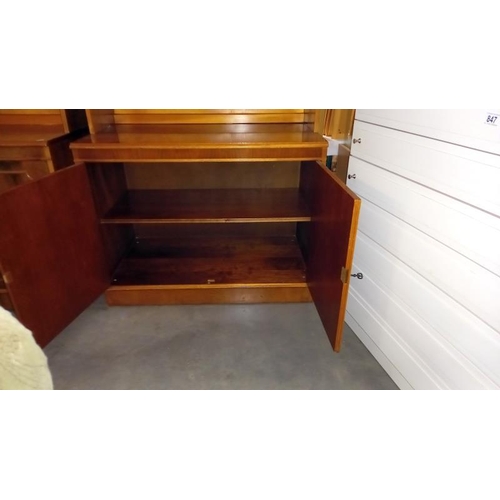 845 - A dark wood stained bookcase on cupboard base, 95cm x 53cm x 210cm high, COLLECT ONLY