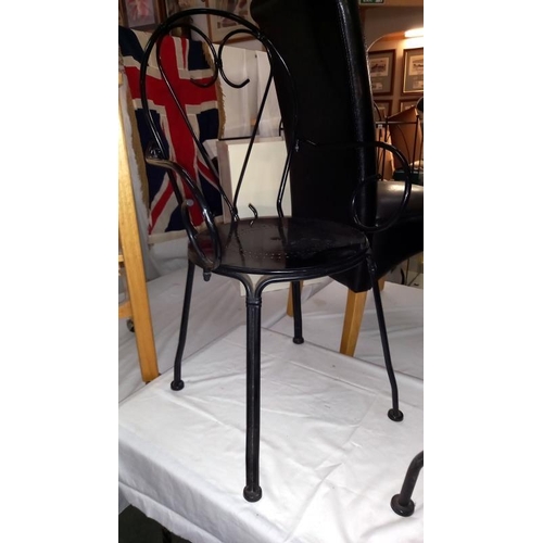 851 - A black wrought iron garden table & chairs, COLLECT ONLY