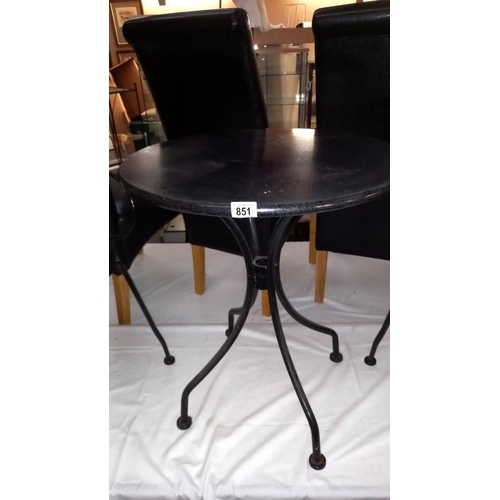 851 - A black wrought iron garden table & chairs, COLLECT ONLY