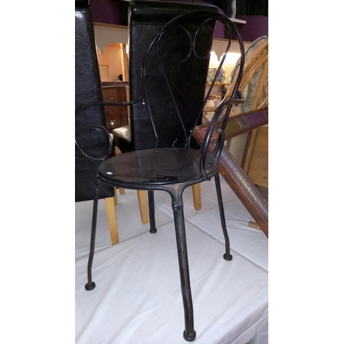 851 - A black wrought iron garden table & chairs, COLLECT ONLY