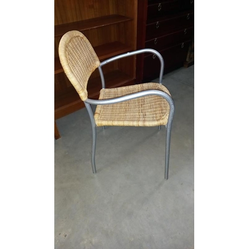 862 - A metal framed chair with wicker seat & back panel, COLLECT ONLY