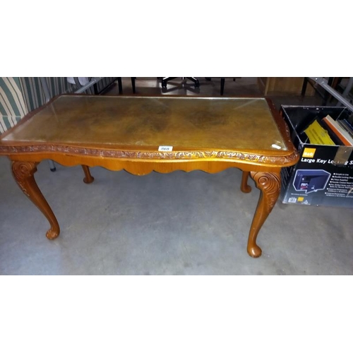 868 - A glass top coffee table with walnut veneered top, 95cm x 50cm x 47cm high, COLLECT ONLY