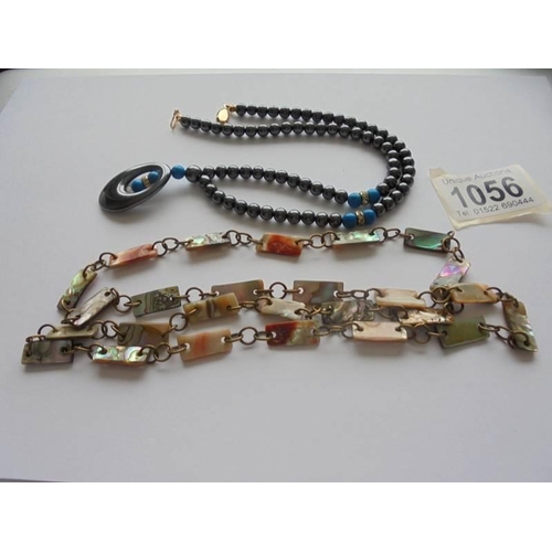 1056 - A vintage abalone shell necklace together with a hematite necklace with turquoise coloured stone ins... 