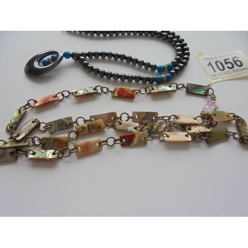 1056 - A vintage abalone shell necklace together with a hematite necklace with turquoise coloured stone ins... 