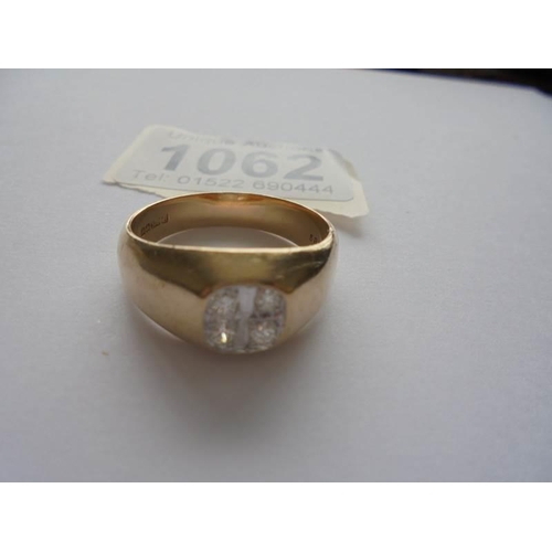 1062 - A gent's diamond four stone ring in 9ct gold, size W.