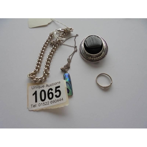 1065 - A silver kerb link bracelet, silver brooch, silver pendant, silver ring and silver charm.