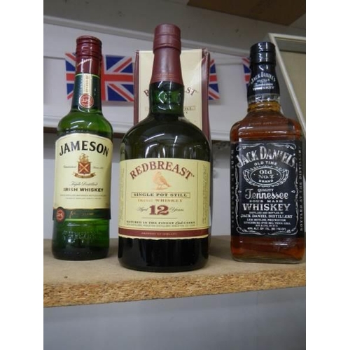 1078 - Three bottles of whisky - Redbrest, Jamesons and Jack Daniels.