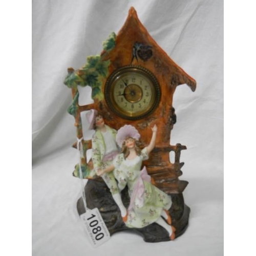 1080 - An early 20th century bisque porcelain mantel clock in working order.