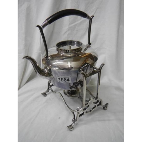 1084 - An early 20th century silver plate kettle on stand.