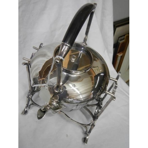 1084 - An early 20th century silver plate kettle on stand.