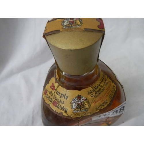 1088 - A bottle of 60 year old Dimple whisky.