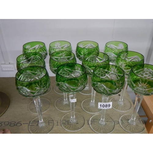 1089 - A good set of twelve overlaid long stemmed glasses.