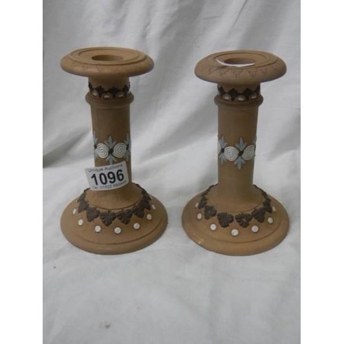 1096 - A pair of good Doulton Lambeth candlesticks.