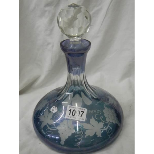 1097 - A blue overlaid glass decanter.