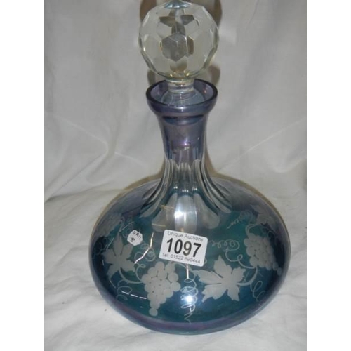 1097 - A blue overlaid glass decanter.