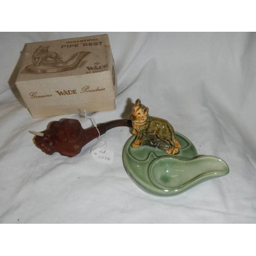 1098 - A Wade pipe stand and a cased pipe in the form of an elephant.