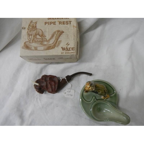 1098 - A Wade pipe stand and a cased pipe in the form of an elephant.