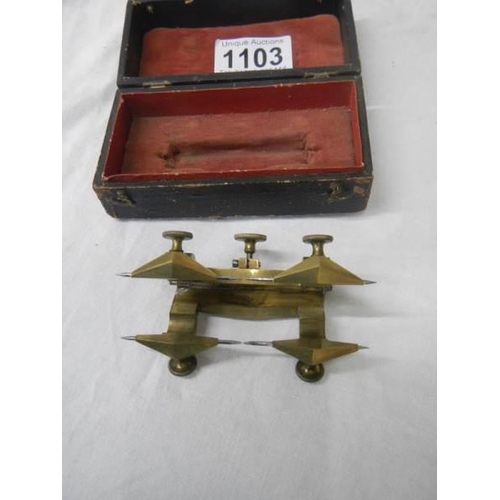 1103 - An unusual cased brass measuring item.