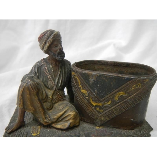 1108 - A mid Victorian figure of an Indian gentleman sitting on a carpet (possibly a pin cushion but missin... 