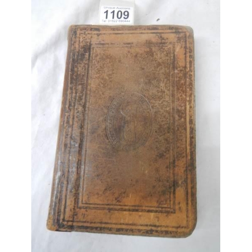 1109 - An early leather bound New Testament (damage to back of book),