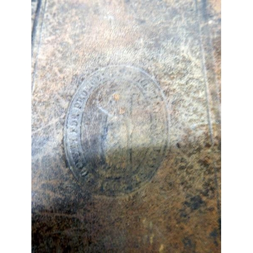 1109 - An early leather bound New Testament (damage to back of book),