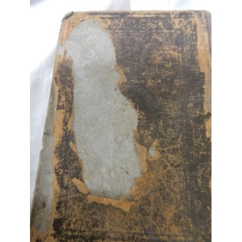 1109 - An early leather bound New Testament (damage to back of book),