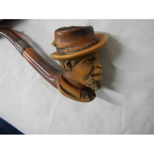 1111 - An old cased Meerscham pipe of a man's head.