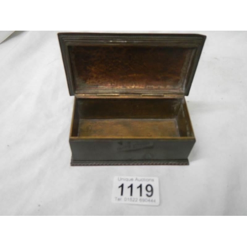 1119 - A small bronze box with blue inlay.