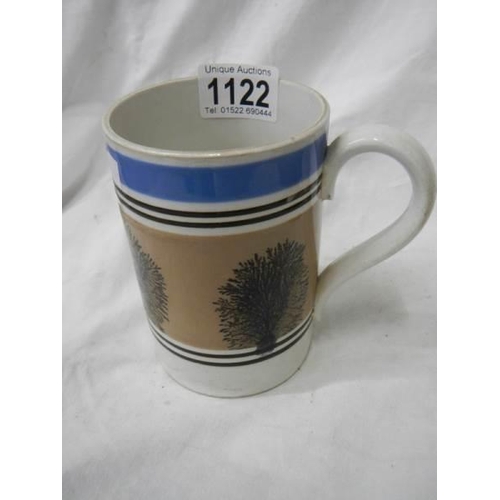 1122 - An antique Mocha ware jug