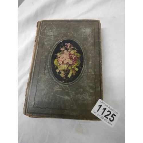 1125 - An antique postcard album containing many historical photographs and postcards.