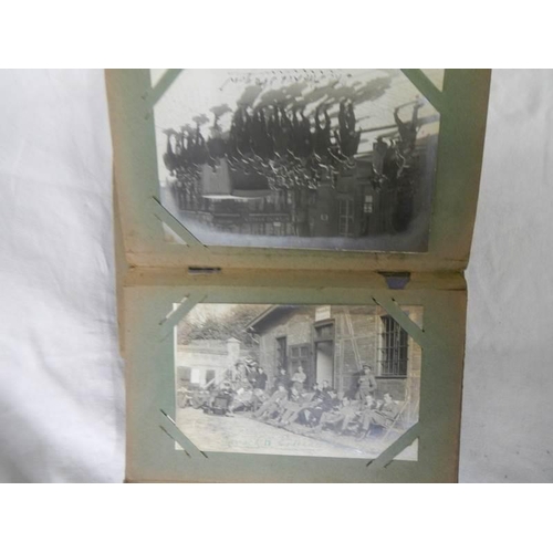 1125 - An antique postcard album containing many historical photographs and postcards.