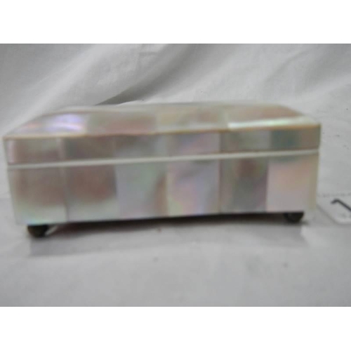 1135 - A mother of pearl stamp box, in good condition.