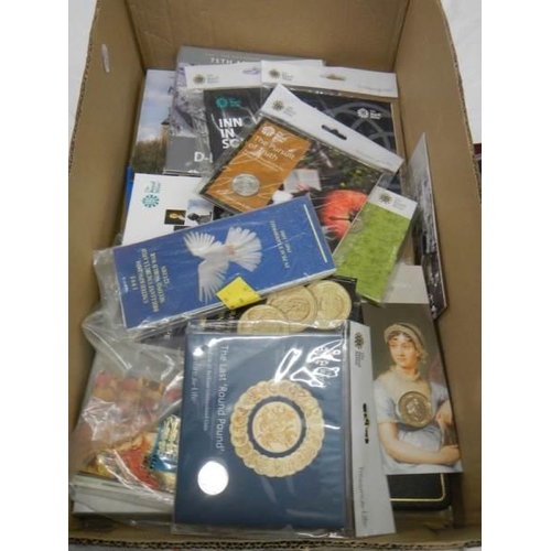 1147 - A large box of assorted coins and coin sets.