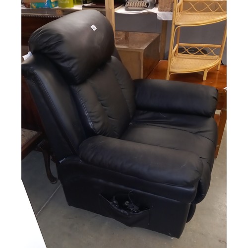 952 - A black leather electric reclining arm chair