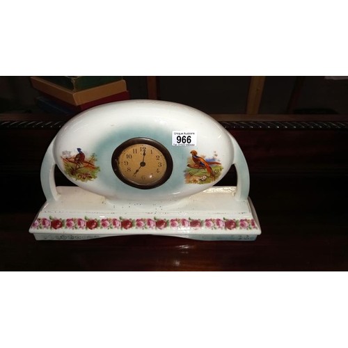 966 - A 1930's pottery clock set decorated with flowers & pheasants A/F (movement incomplete)