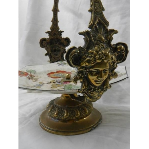 1161 - A WMF brass mounted cake stand with ceramic cake plate.