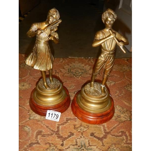 1179 - A pair of heavy brass figures.