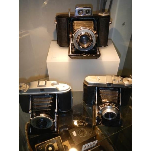 1180 - Three good folding camera's.